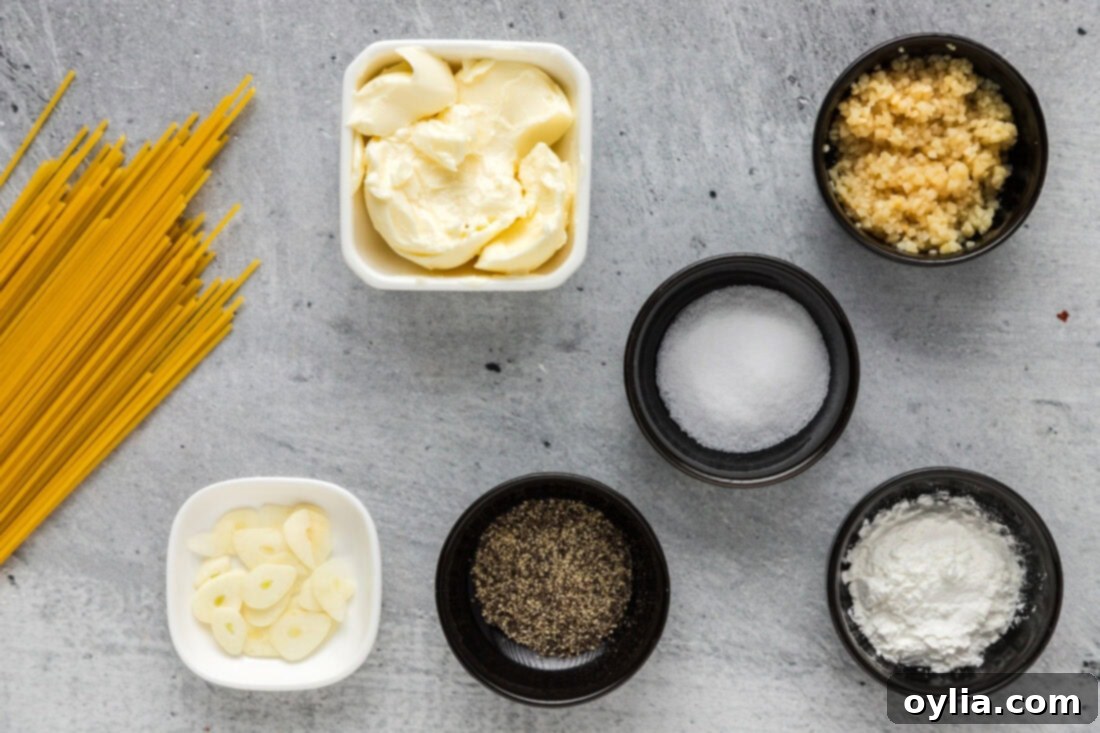 Buttery Garlic Noodle Bliss 4 Collection of fresh ingredients for Garlic Butter Pasta including butter, garlic, spaghetti, and seasonings