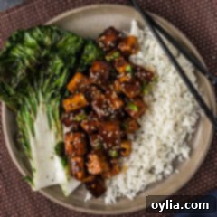 Overhead photo of a plate of Spicy Tofu, rice, and chopsticks