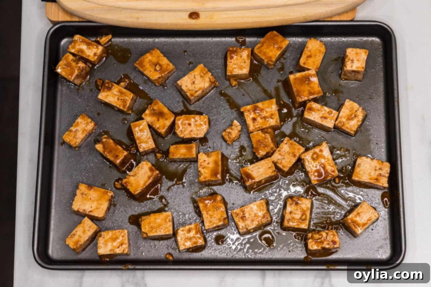sauced tofu on a baking sheet