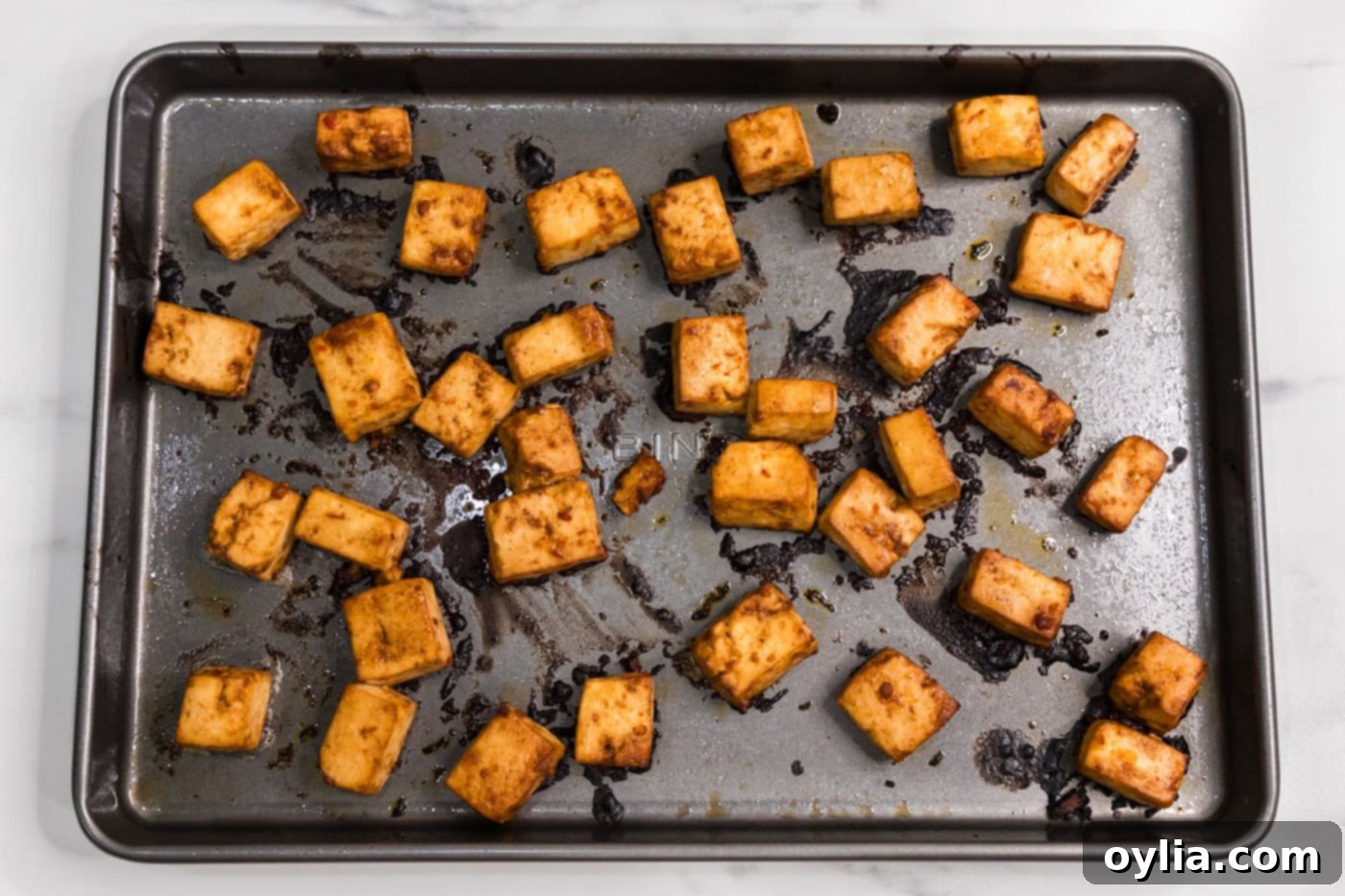 baked spicy tofu on a baking sheet