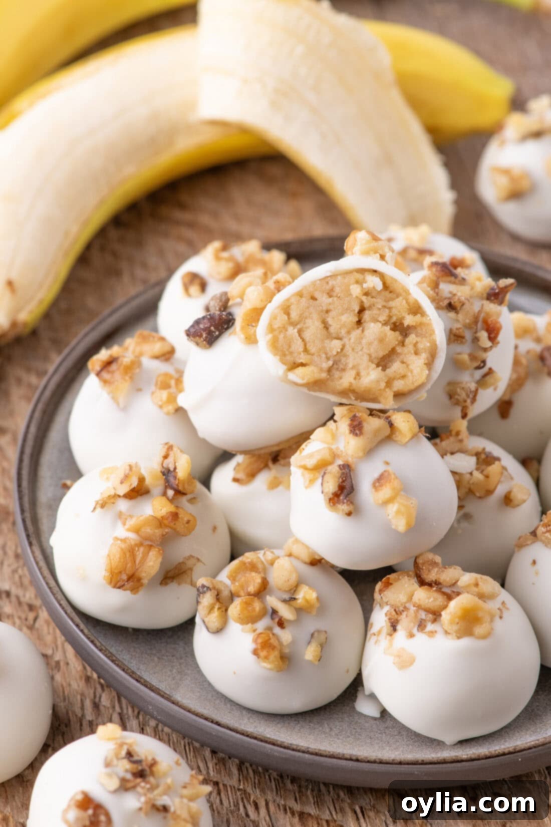 Decadent Banana Truffles 2 Banana Truffles stacked on a plate with one cut in half