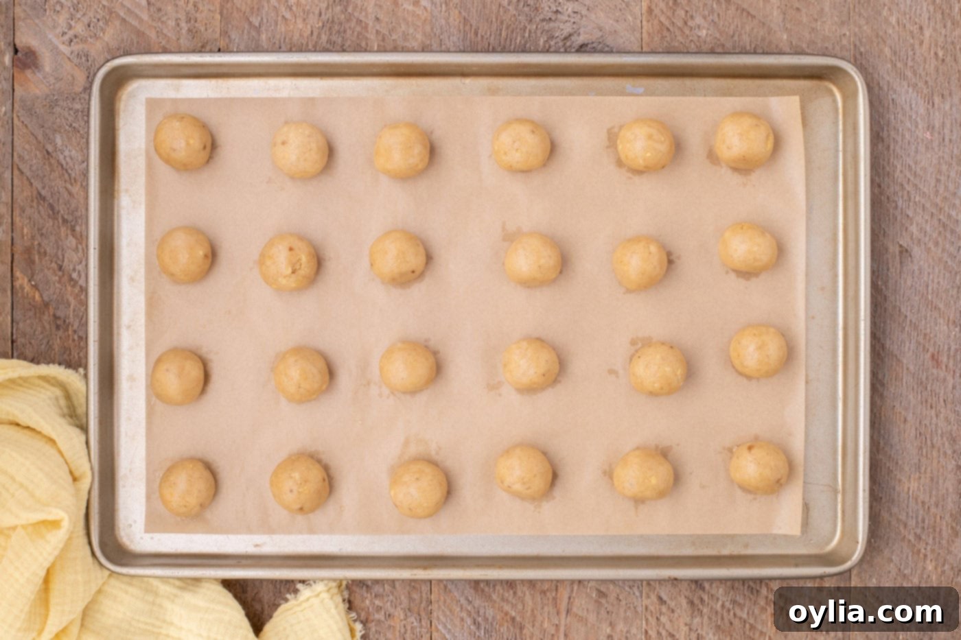 banana truffles on a parchment lined baking sheet