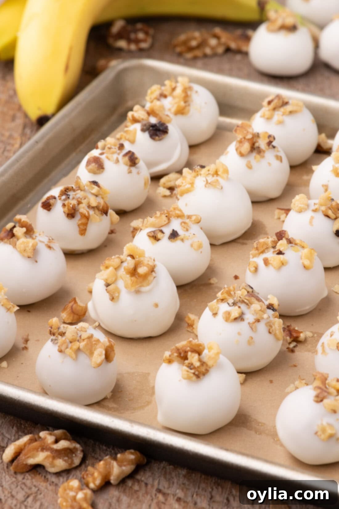 Decadent Banana Truffles 3 Banana Truffles on a parchment lined baking sheet