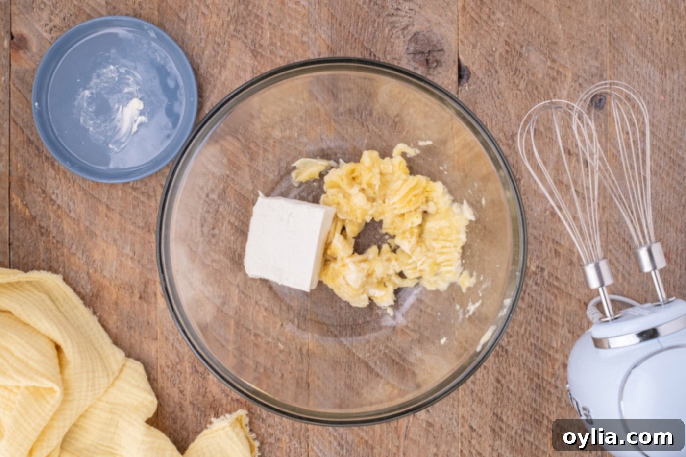 mashed bananas with cream cheese in a bowl