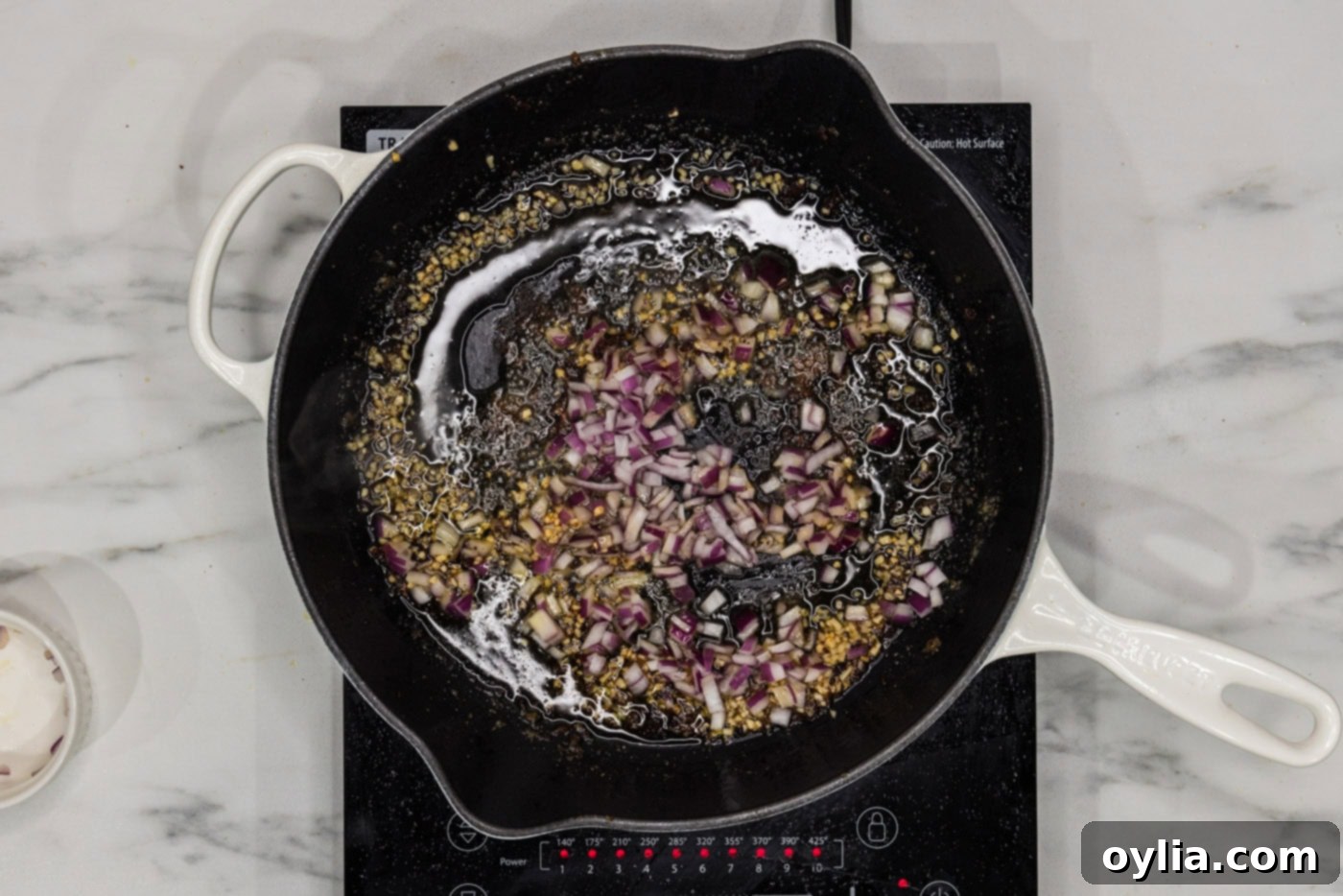 garlic and red onion in a skillet