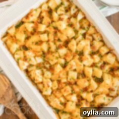 overhead shot of cheese potatoes in a casserole dish