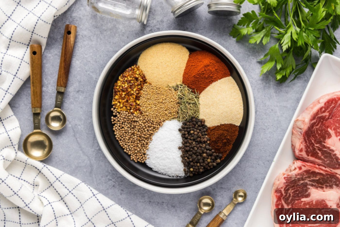 spices and herbs spooned into a bowl neatly