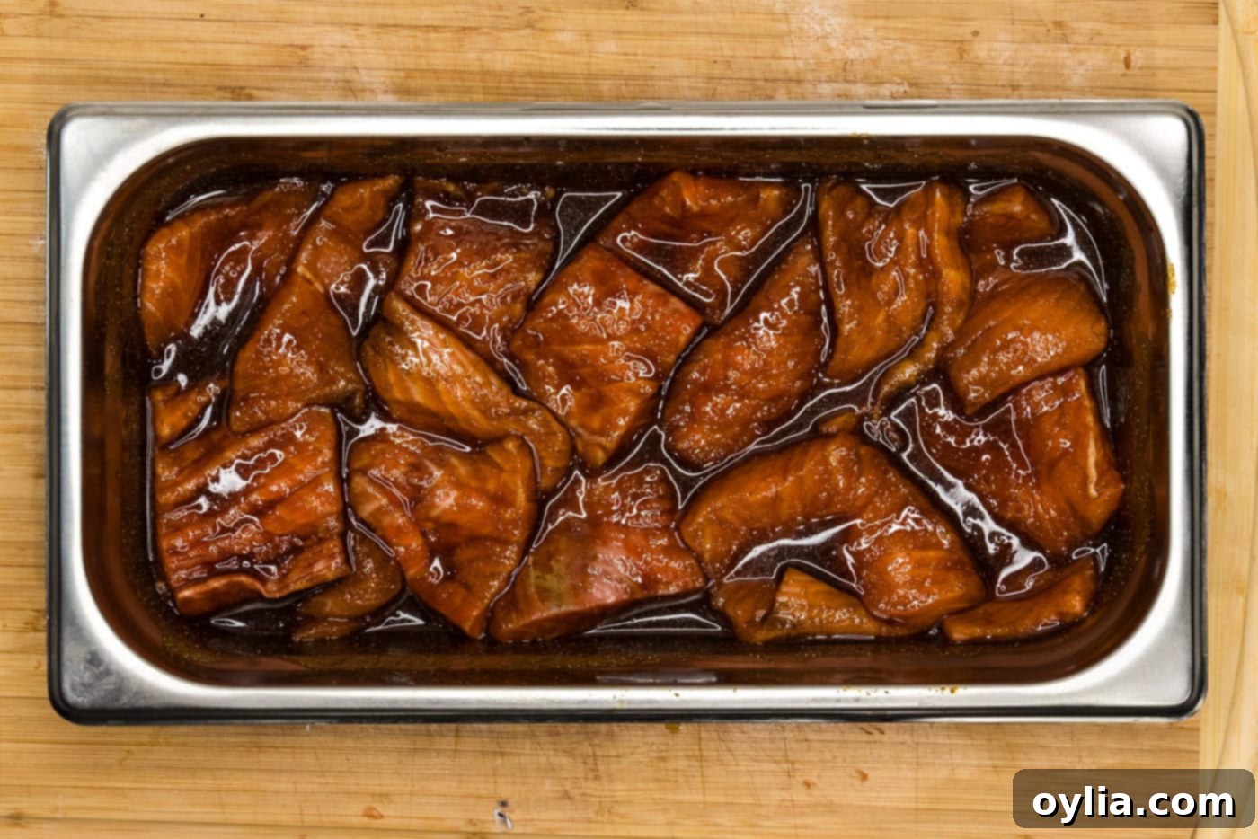 marinated salmon slices in a tray