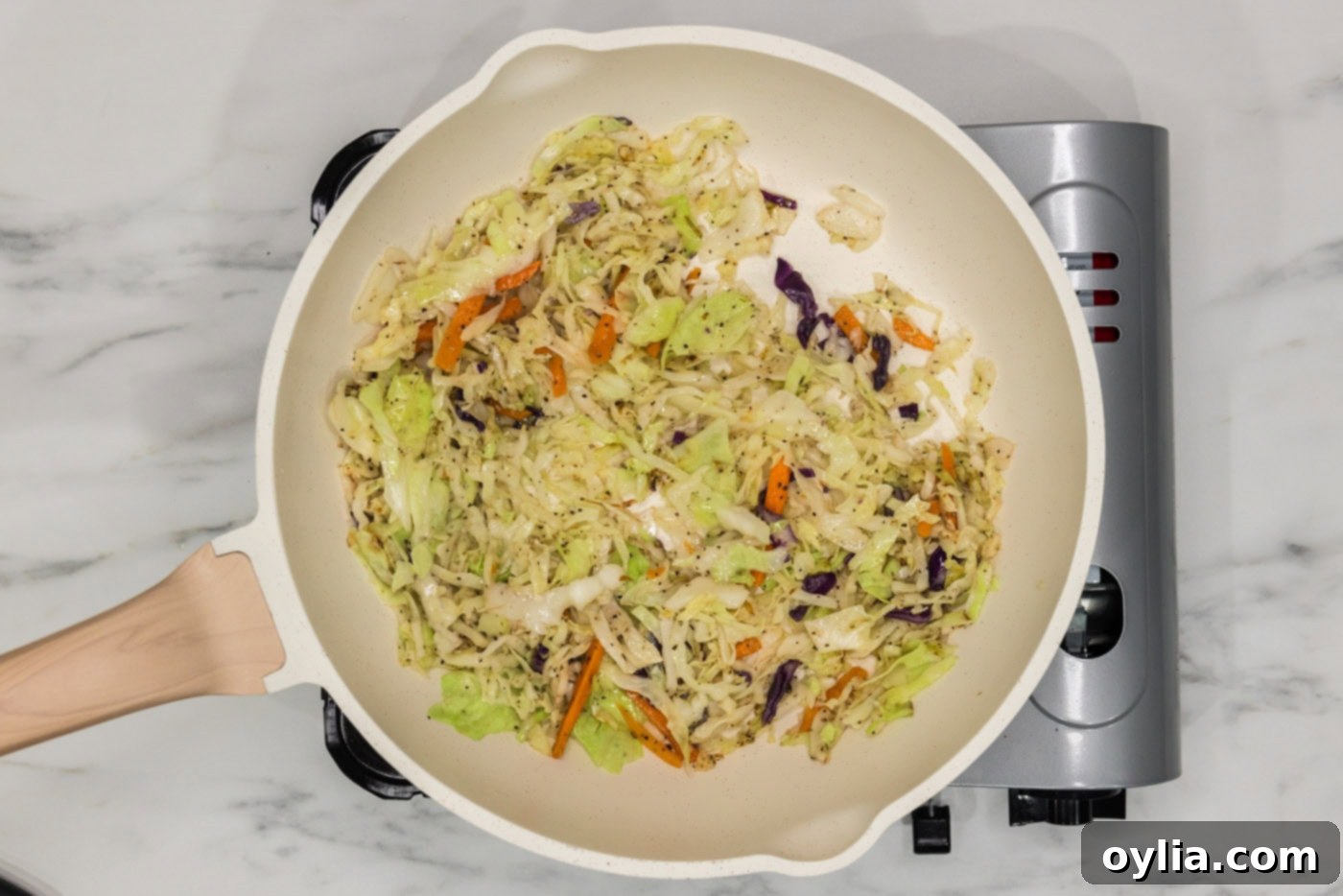 sauteed coleslaw in a skillet