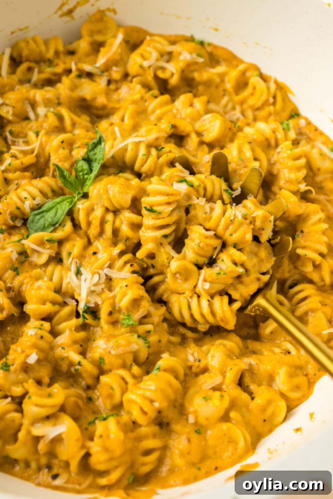 Close up photo of Butternut Squash Pasta in a skillet with a spoon