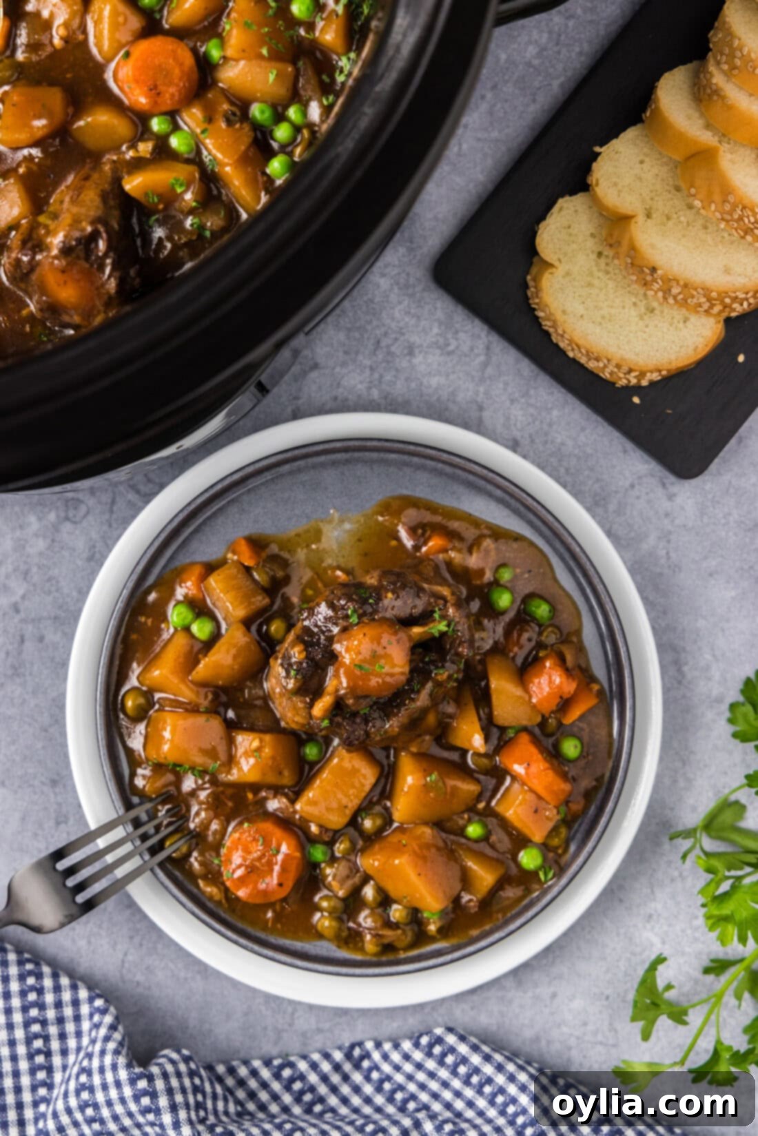 Braised Oxtail in a Slow Cooker 2 Slow Cooker Oxtail on a plate with a fork