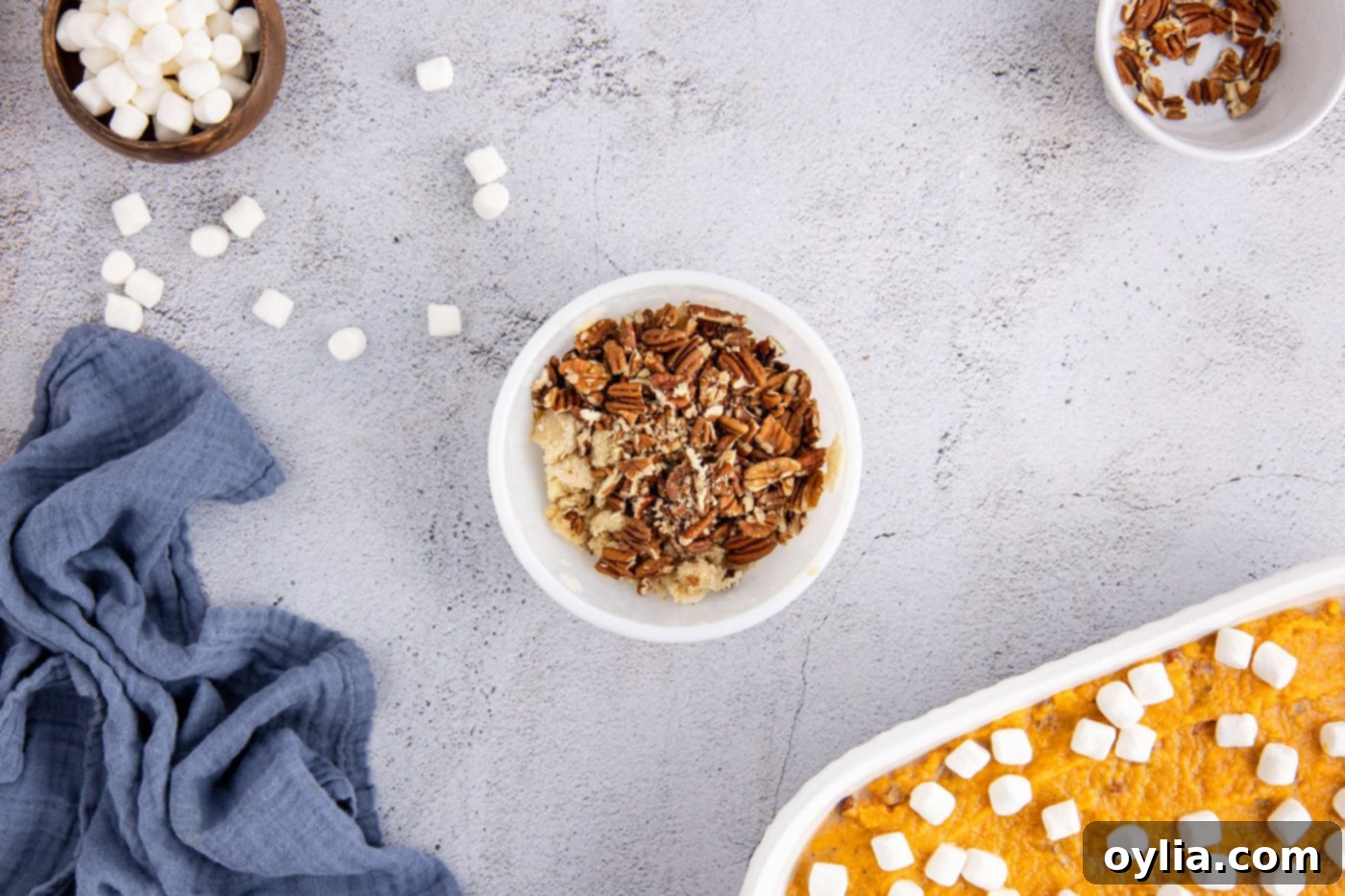 pecans added to streusel topping in a bowl