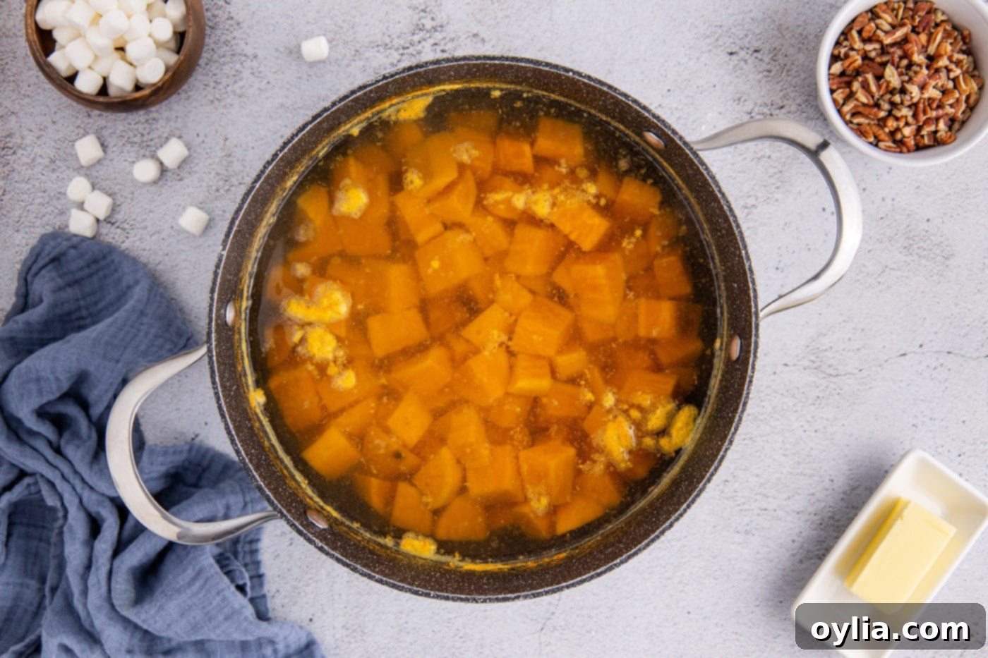 cubed sweet potatoes boiling in water