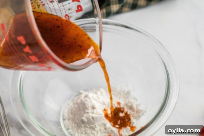 adding broth to cornstarch