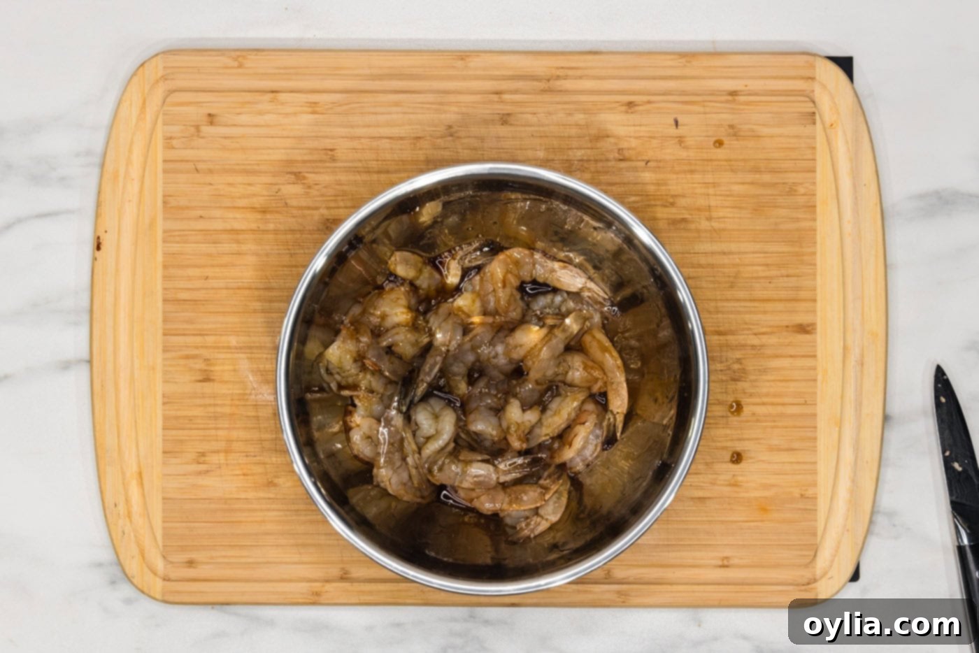 shrimp in a bowl with soy sauce and maple syrup glaze