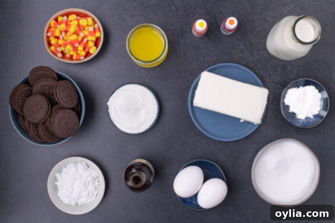 Ingredients for Mini Candy Corn Cheesecakes, including Oreos, cream cheese, and food coloring