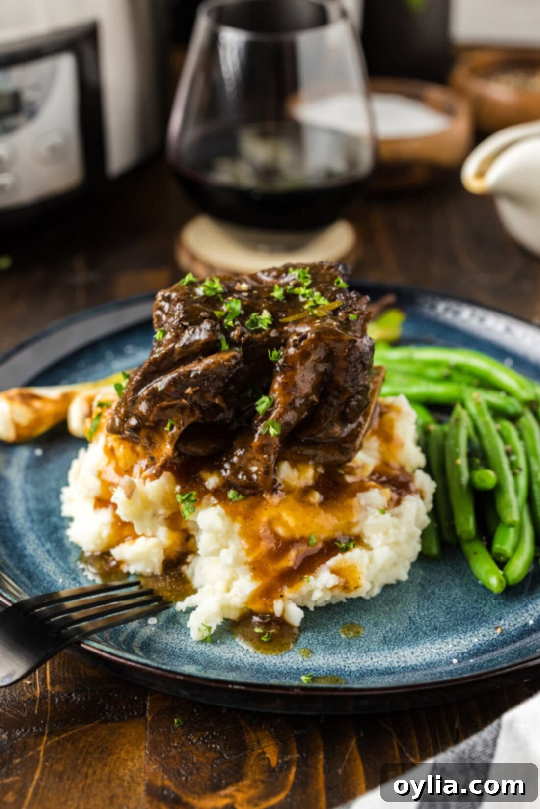 Crockpot Beef Short Rib on top of mashed potatoes 