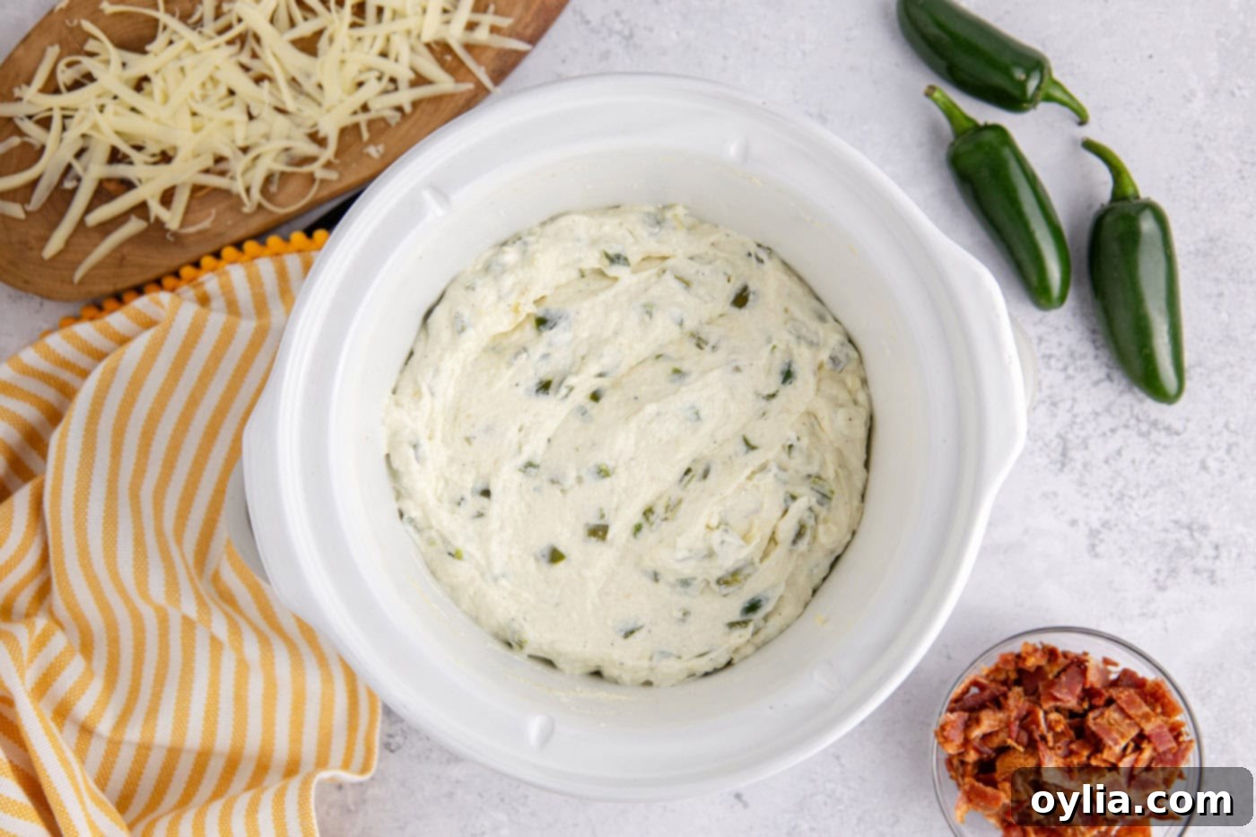 overhead of crockpot jalapeno popper dip in a slow cooker