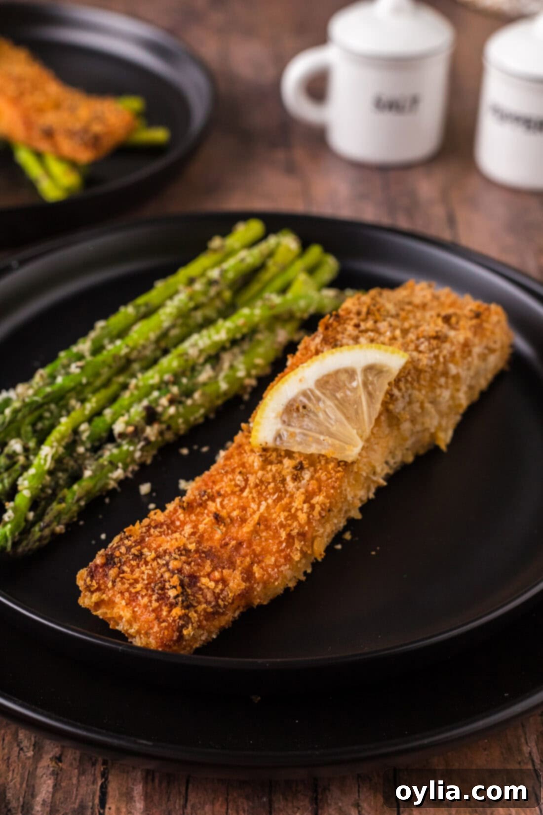 Crusted Salmon on a plate with asparagus 
