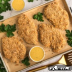 Pretzel Chicken on a baking sheet, freshly baked and golden