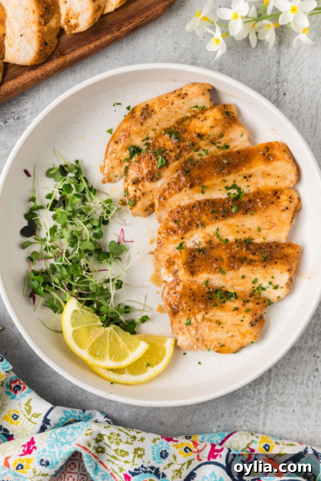 Sliced Sous Vide Chicken Breast on a plate, showcasing its juicy interior