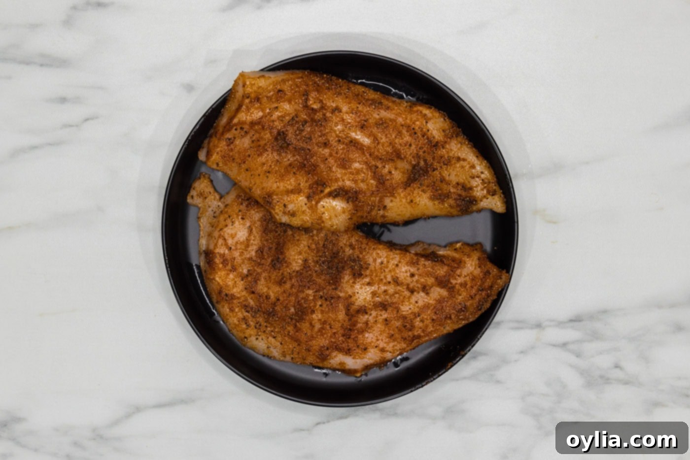 chicken breasts thoroughly rubbed with olive oil and a savory seasoning blend