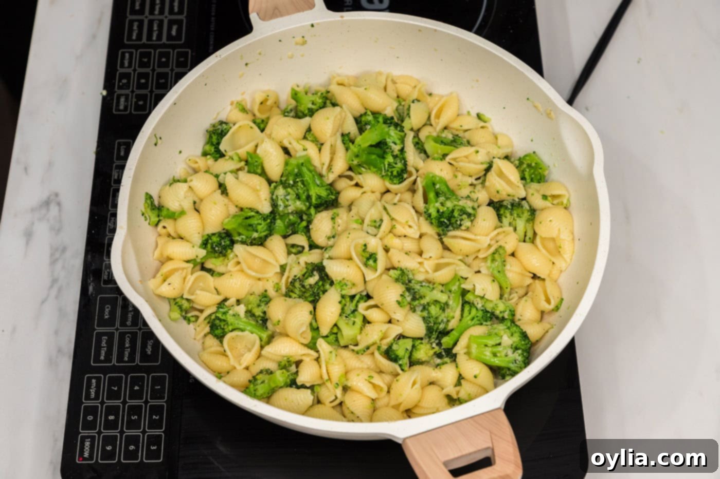 broccoli pasta with parmesan in a skillet