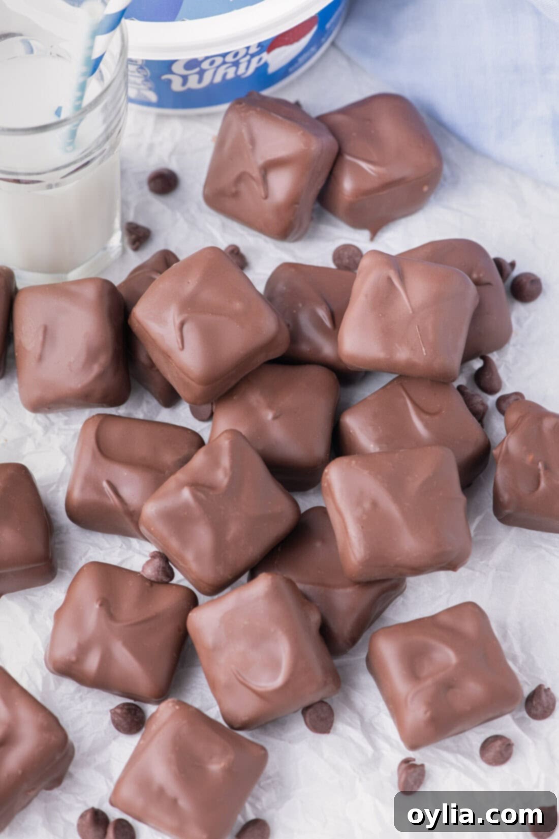 Cool Whip Candy scattered on a table with chocolate chips