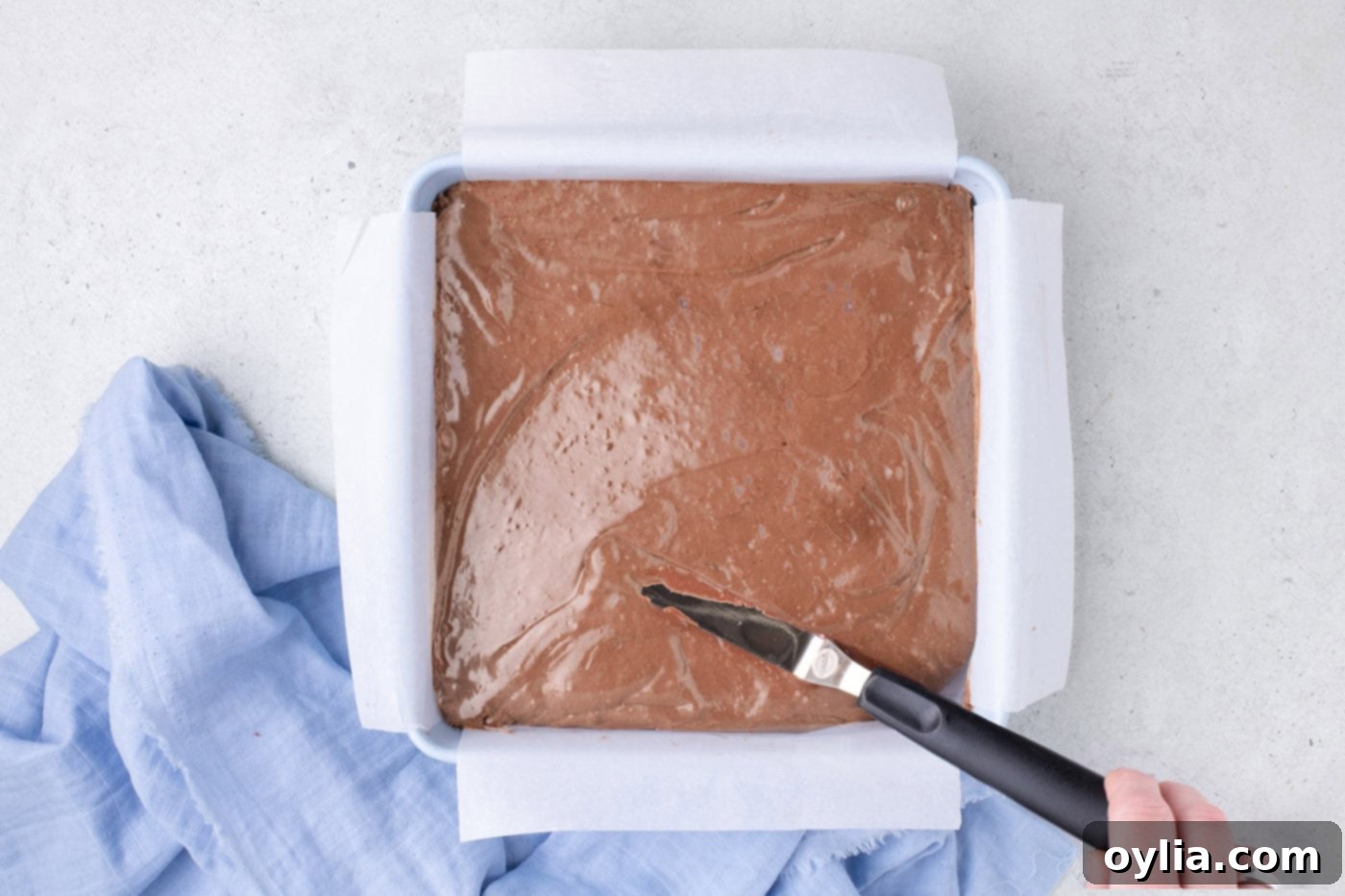 whipped chocolate mixture added to baking pan