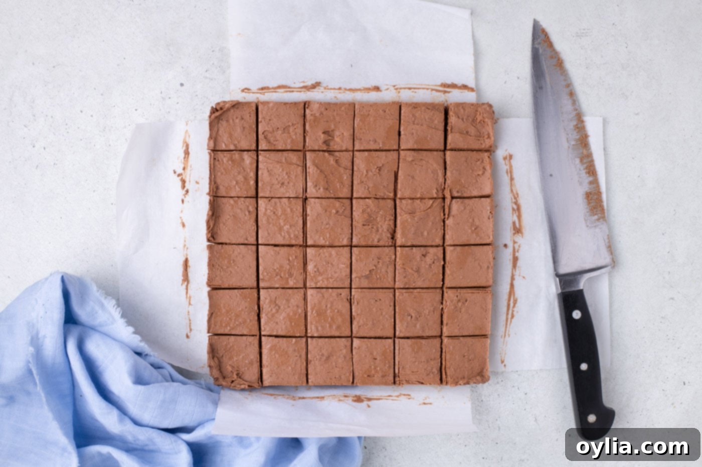 whipped chocolate sliced into squares in a baking pan