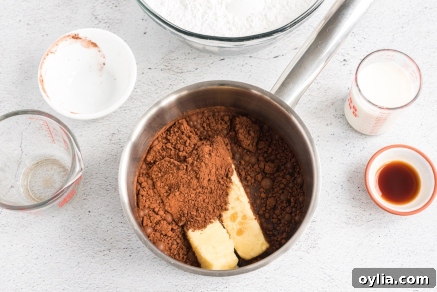 Butter, Coca-Cola, and cocoa powder melting in a saucepan
