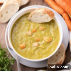 Hearty Instant Pot Split Pea Soup 6 Bowl of Instant Pot Split Pea Soup with a slice on bread on it