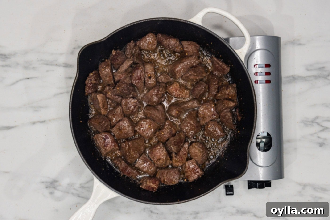 cooked cubed steak in a skillet