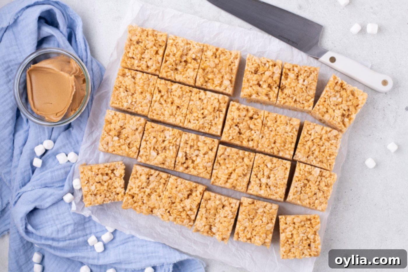 sliced peanut butter rice krispie treats on parchment paper