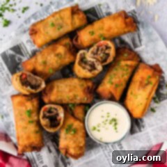 Close up photo of a platter of Philly Cheesesteak Egg Rolls