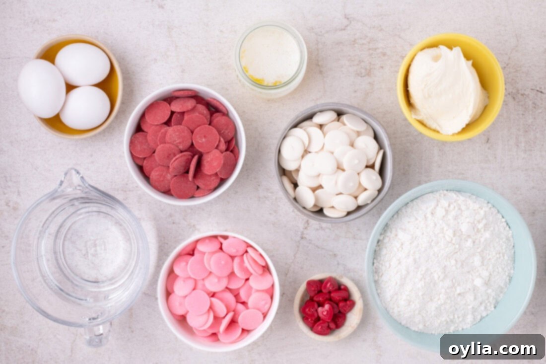 Love-Filled Valentine Cake Pops 4 A flat lay of all the essential ingredients for making Valentine Cake Pops, including cake mix, frosting, candy melts, and sprinkles, neatly organized for easy viewing.