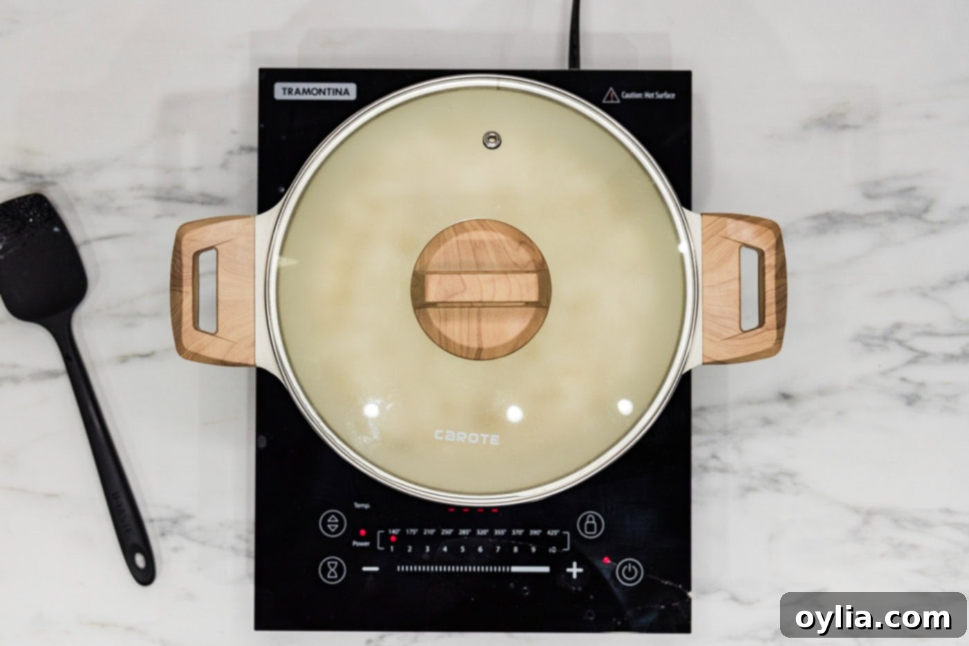 Pasta-Boiled Rice 7 Pot of rice covered with a lid, steaming on the stovetop