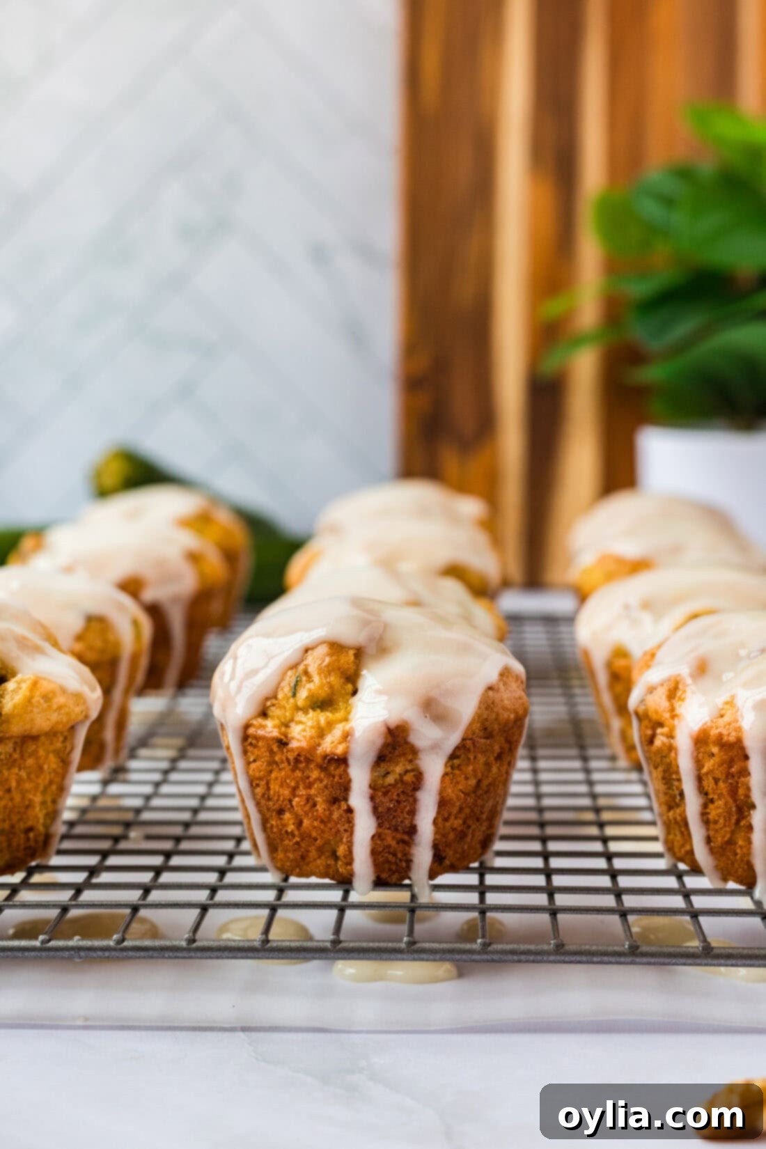 Zucchini Muffins in a Flash 1 Shortcut Zucchini Muffins on a wire rack cooling after baking