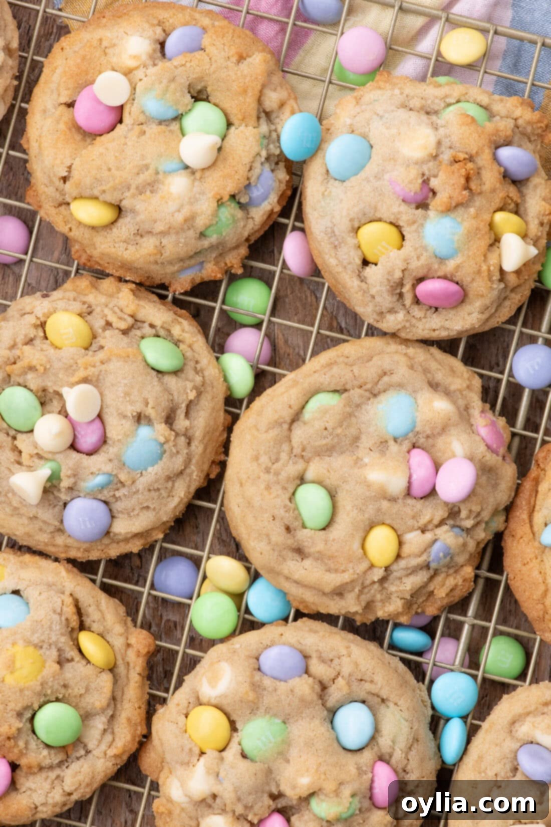 Easter M&M Cookies resting on a wire rack, showcasing their vibrant colors and perfect texture.