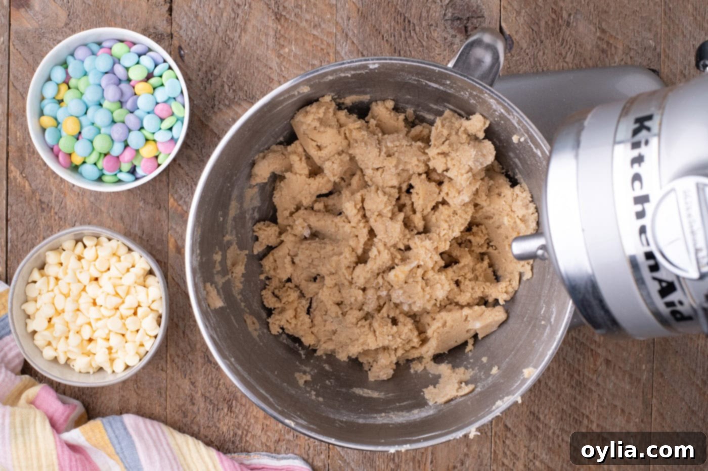 Cookie dough in a stand mixer bowl, showing a well-combined but not overmixed consistency.
