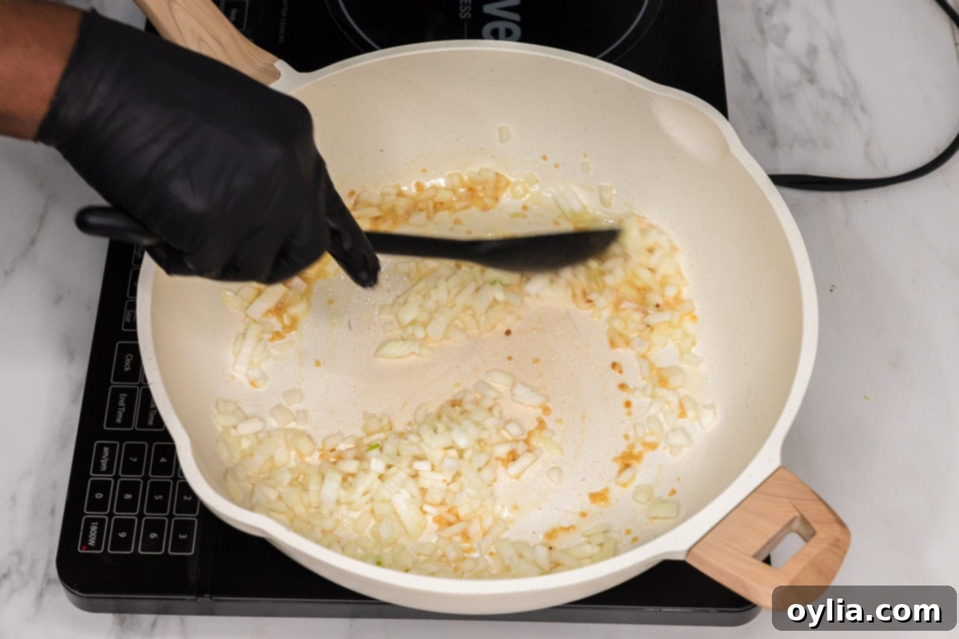 sauteeing garlic and onion in a skillet