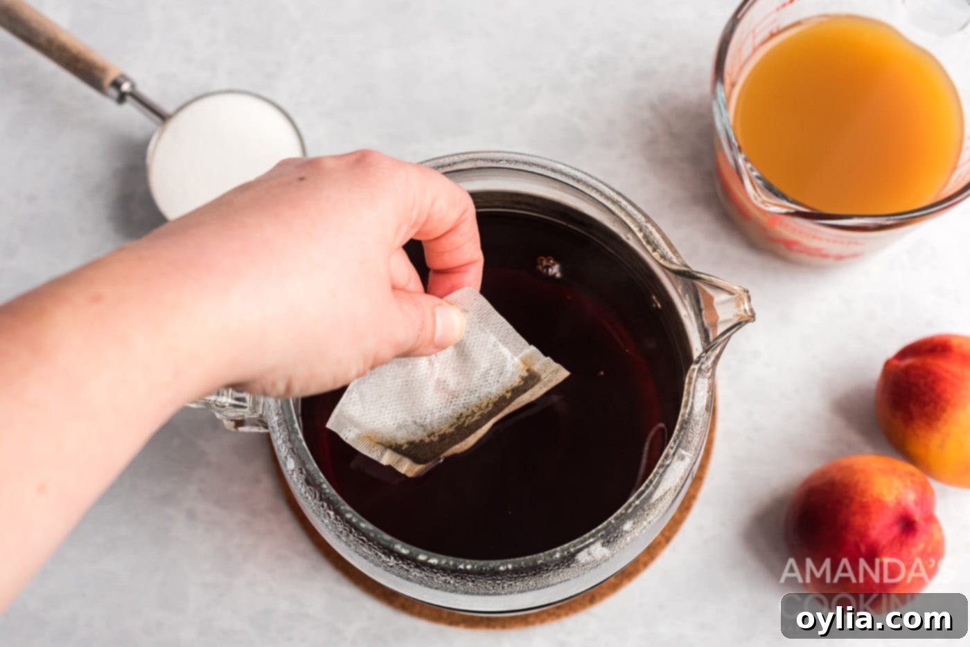 Adding cold brew tea bags to a pitcher of water