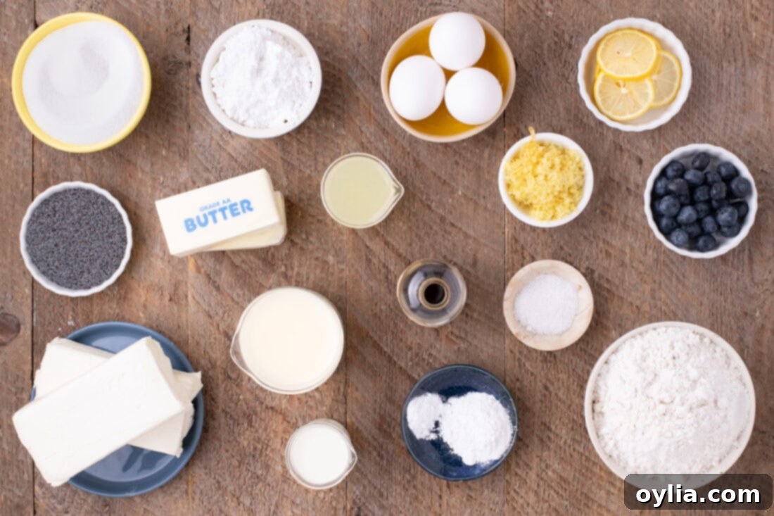Assorted ingredients laid out for making Lemon Poppy Seed Cake including lemons, flour, sugar, butter, and poppy seeds.