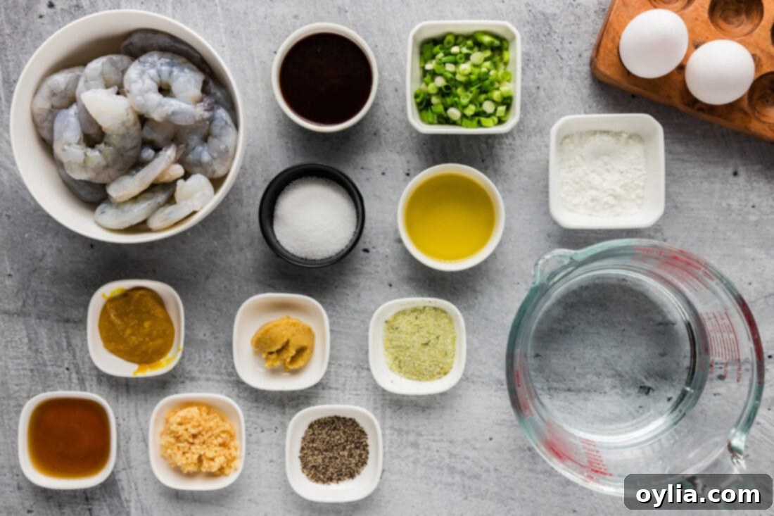 A visual spread of fresh ingredients for Shrimp with Lobster Sauce, including shrimp, eggs, sauces, and aromatics