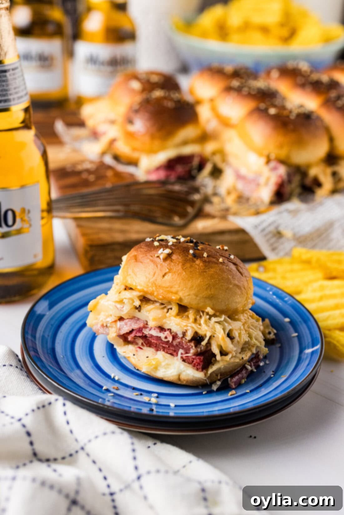 Reuben Sliders on a plate, showcasing their golden-brown tops and rich filling