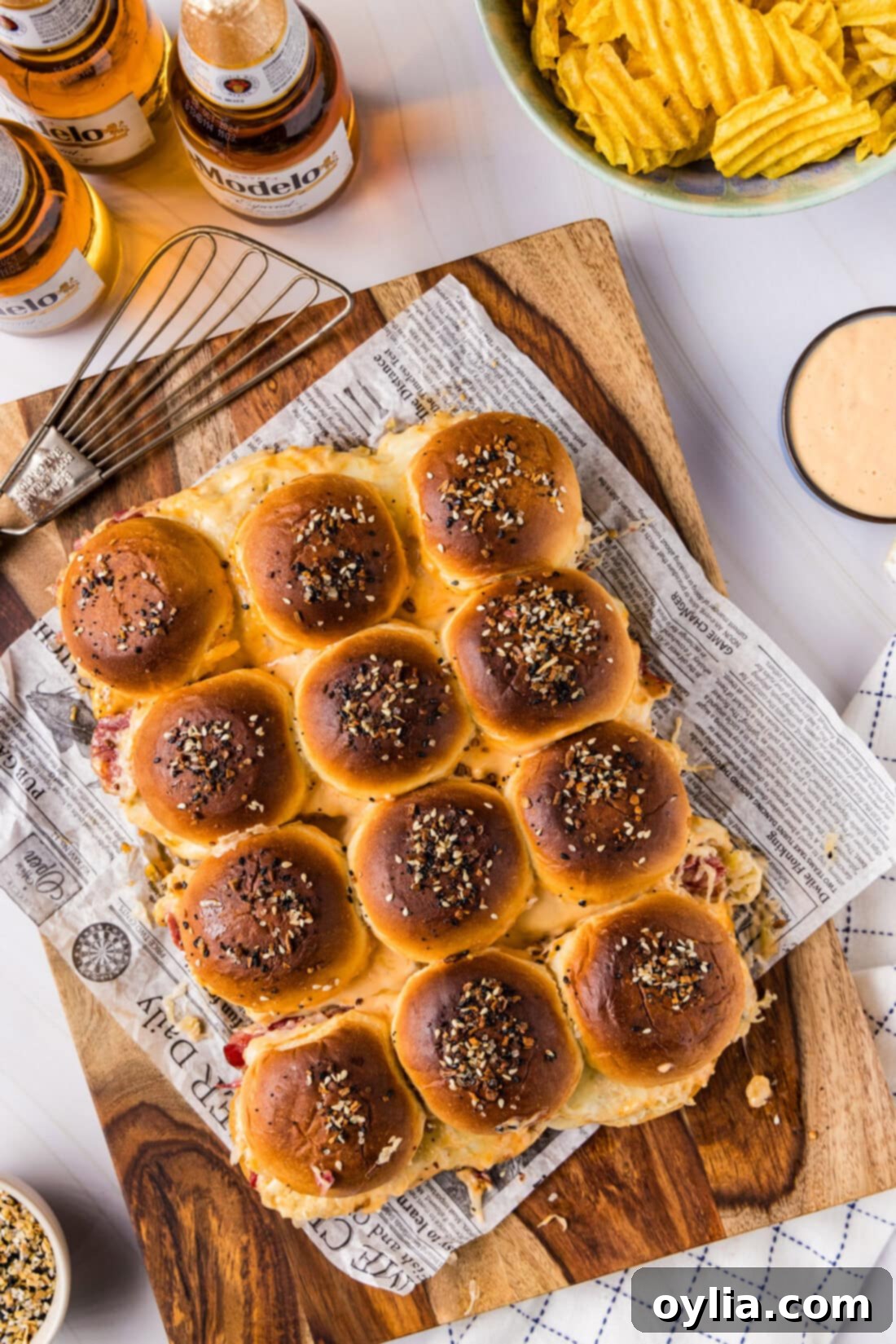 Reuben Sliders beautifully arranged on a rustic wooden platter, ready to be served