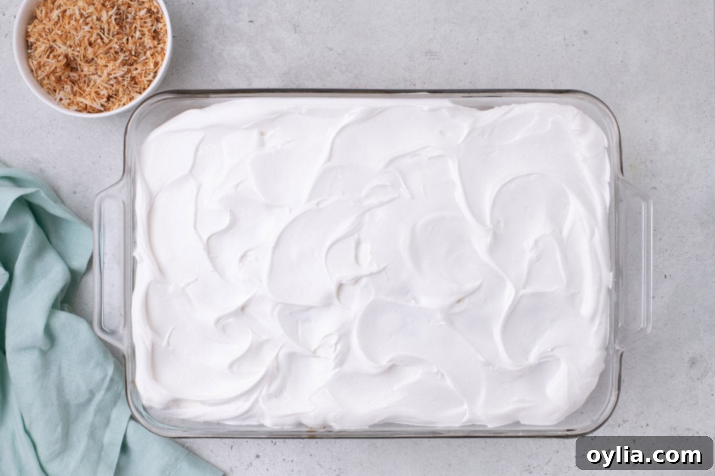 whipped topping spread over cake