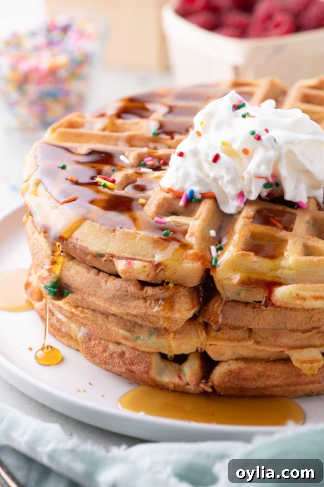 Close up photo of a stack of Cake Mix Waffles, showing their golden crisp edges and soft interior.