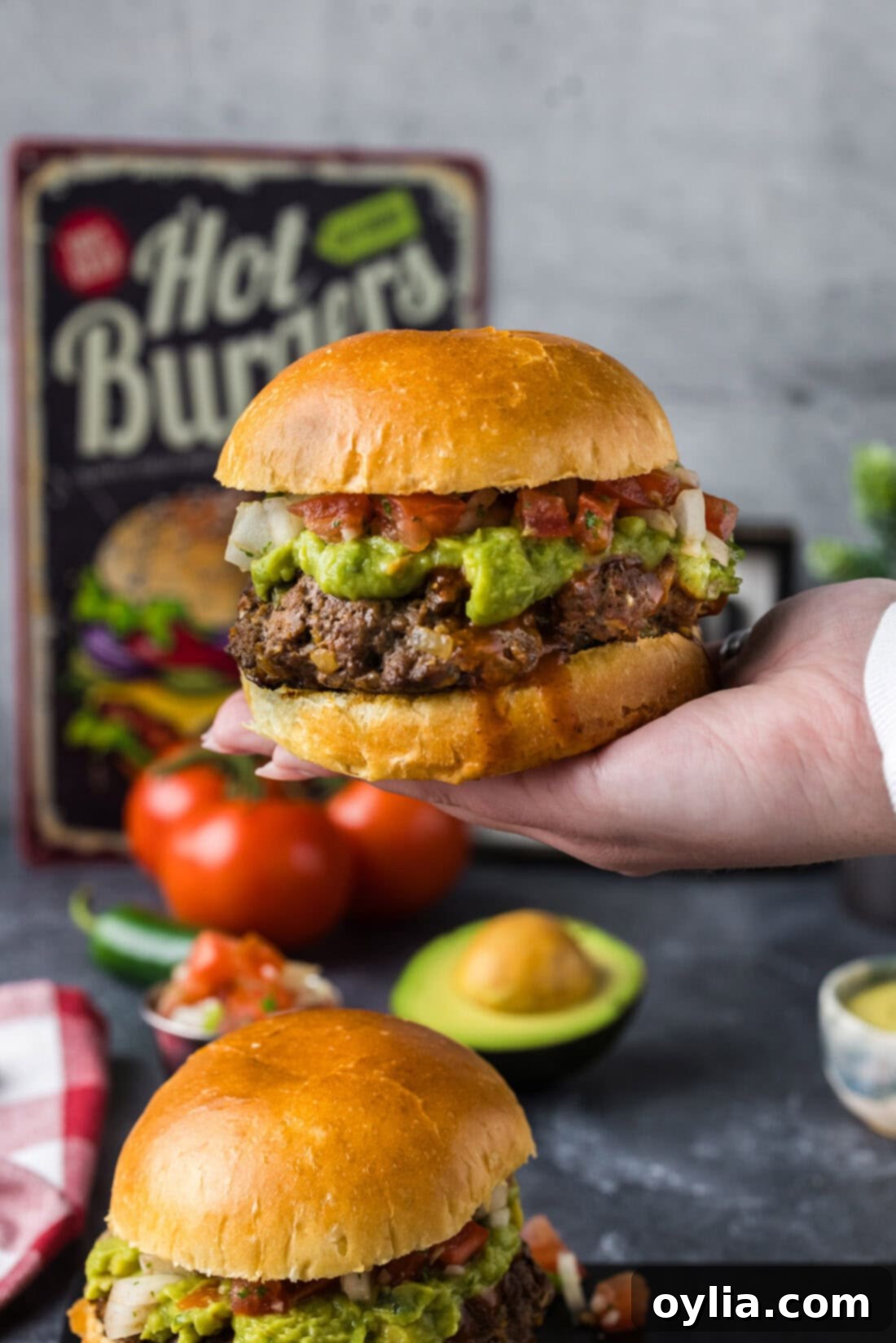 Hand holding up a Taco Burger