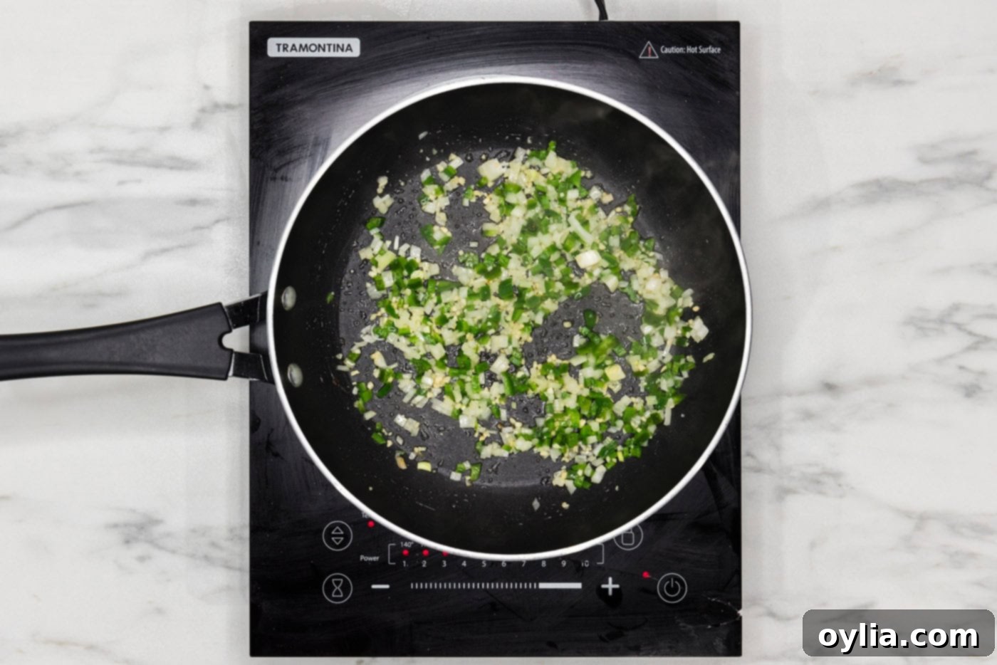 diced onion and jalapenos in a skillet